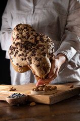 Colomba with chocolate. Easter Italian cake with almonds and chocolate in the shape of a dove....