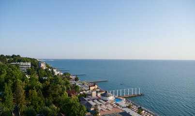 Fototapeta premium August 21, 2022, Sochi, Russia. Embankment of the Black Sea and the beach in Sochi