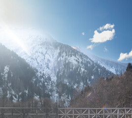 Snowy mountains and sky on a sunny winter day. A view from Rize Ayder plateau.Camlihemsin, Rize, Turkey. 
