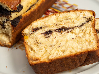 Freshly baked bread with poppy seeds.