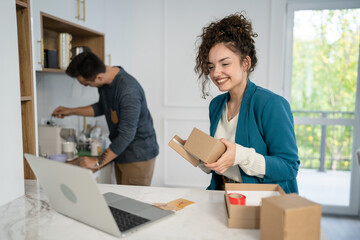 couple woman and man open presents gift during video call online