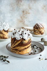 traditional Easter cake, cruffin with chocolate and glaze on a ceramic plate