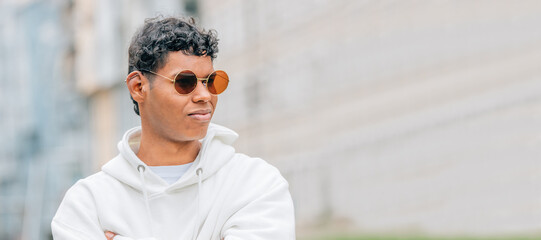 portrait young man with sunglasses on the street