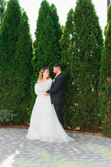 lovers and gentle dancing happy bride and groom in nature. 