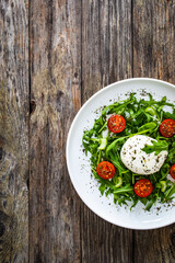 Mozzarella salad on wooden board
