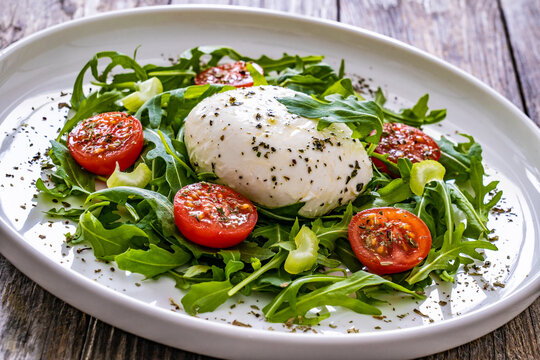 Mozzarella salad on wooden board