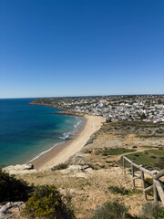 Fototapeta na wymiar Praia Da Luz Beautiful sandy beach near Lagos in Ponta da Piedade, Algarve region, Portugal.