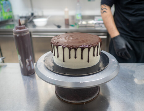 Cake Pastry Chef Designer Decoration A Dark Chocolate Frosted Icing White Cake With Brown Dripping With Ganache Filling