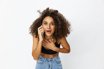 Woman blogger with phone in hand on white background selfies, video call, freelancer influencer job in social media and media, technology for work, smile curly hair copy spot