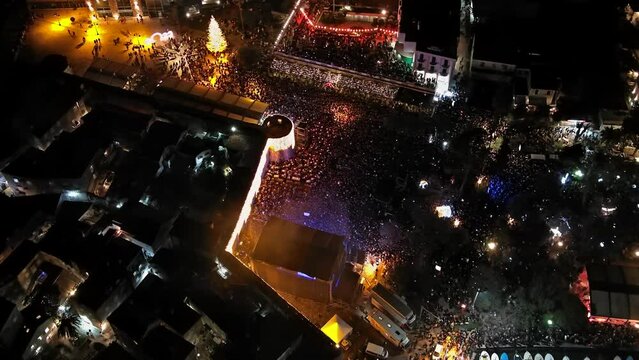 Aerial top view of the crowd on night celebration event concert, 4k
