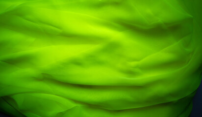 Photo of light green fabric. Green three-dimensional background.