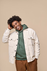 Happy young African American gen z guy isolated on beige background. Smiling hipster ethnic teen...