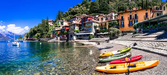 Poster One of the most beautiful lakes of Italy - Lago di Como. panoramic view of beautiful Varenna village, popular tourist attraction © Freesurf