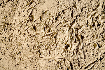 Stone wall texture/The white walls are made of mortar mixed with hay and rice straw.