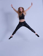 Obraz premium young woman with long hair jumping happy