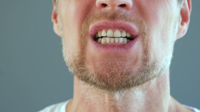 Man mouth doing exercises in speech therapy class. Articulation gymnastics. 