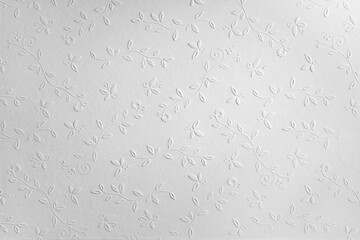 white paper background with embossed flowers, copy space, textured floral pattern - obrazy, fototapety, plakaty