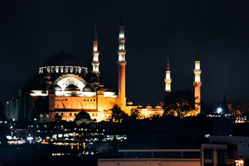 Fototapeta na wymiar Night view of the Suleymaniye Mosque night view, the largest in the city, Istanbul, Turkey. Ramadan wallpaper, background
