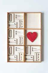 wood heart painted red, shallow box, and letters l, o, v, and e