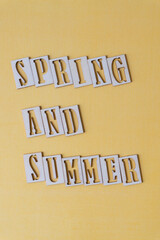 sign with the words "spring and summer"