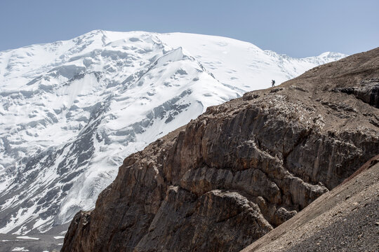 A mountaineer in the approach to advanced basecamp of Peak Lenin
