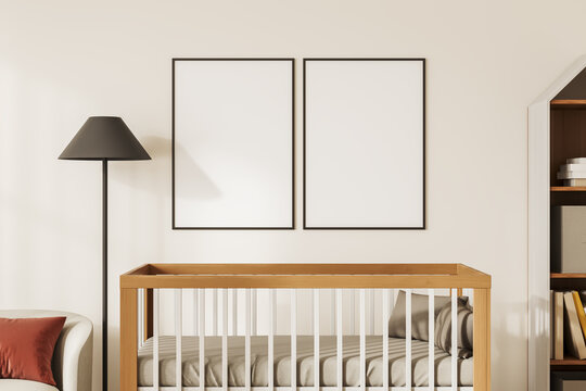 Beige modern baby room interior with crib, decoration and mockup frames
