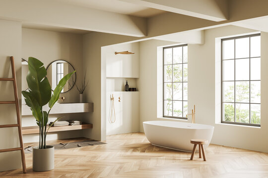 Light bathroom interior with bathtub and douche, washbasins and panoramic window
