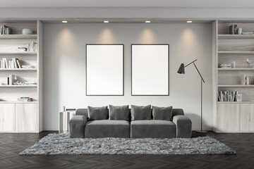 Dark living room interior with two empty white posters