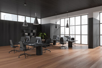 Grey business interior with pc computer on table and shelf near panoramic window