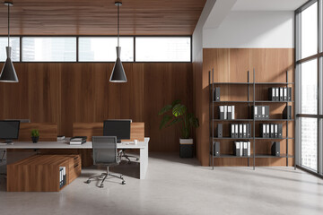 Light office interior with pc computer on desk and shelf with panoramic window