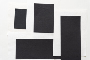 background with black and textured white paper sheets