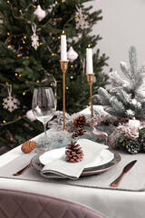 Luxury place setting with beautiful festive decor for Christmas dinner on white table