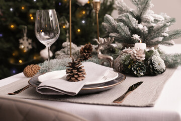 Luxury place setting with beautiful festive decor for Christmas dinner on white table