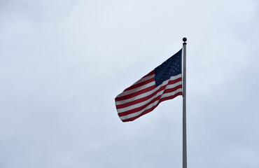 US Flag Blowing in the Breeze on a Flag Pole