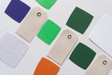 canvas tags and paper squares on blank paper