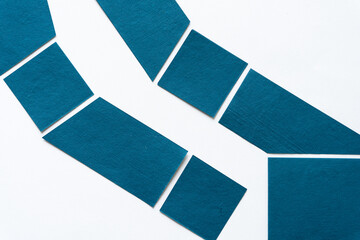 blue paper shapes on white