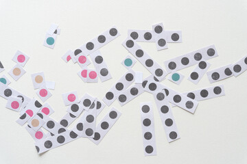 short paper stripes with color and black dots