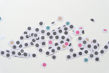 random group of short paper stripes with dots on blank paper