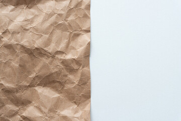 crumpled brown paper with blank white paper 