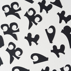 abstract black cutout shapes on white