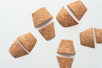 group of cork ribbon shapes arranged on blank paper