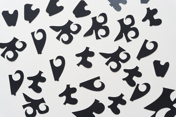 Fototapeta na wymiar abstract black cutout shapes on white