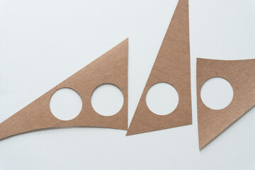 cardboard shapes with round holes
