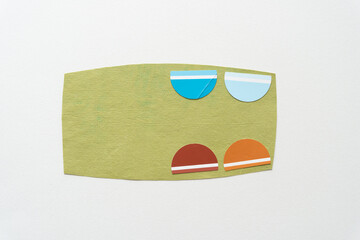 four colorful half circles on green card