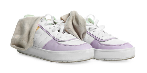 Dirty socks and sneakers on white background