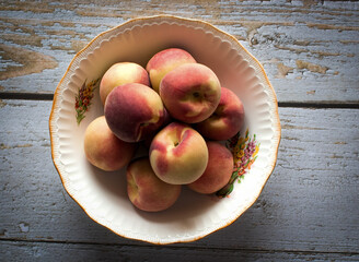 Peaches in antique bowl