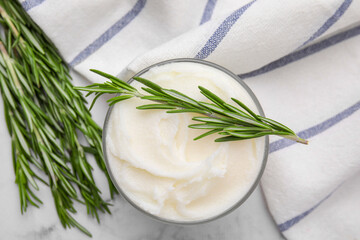 Fototapeta na wymiar Delicious pork lard with rosemary in glass on white marble table, flat lay