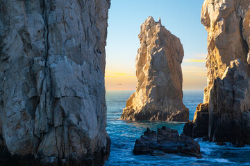 Late afternoon sun hits a rock formation near El Arco arch at the Land's End coastal region at Cabo San Lucas, Mexico, on the Baja Peninsula.