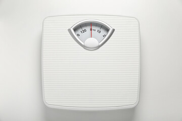 Mechanical scales on white background, top view