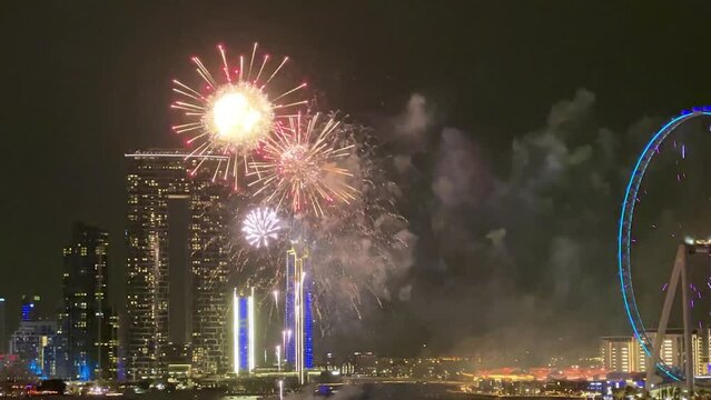 Dubai fireworks, Dubai frame building, ferris wheel, night time, vertical video